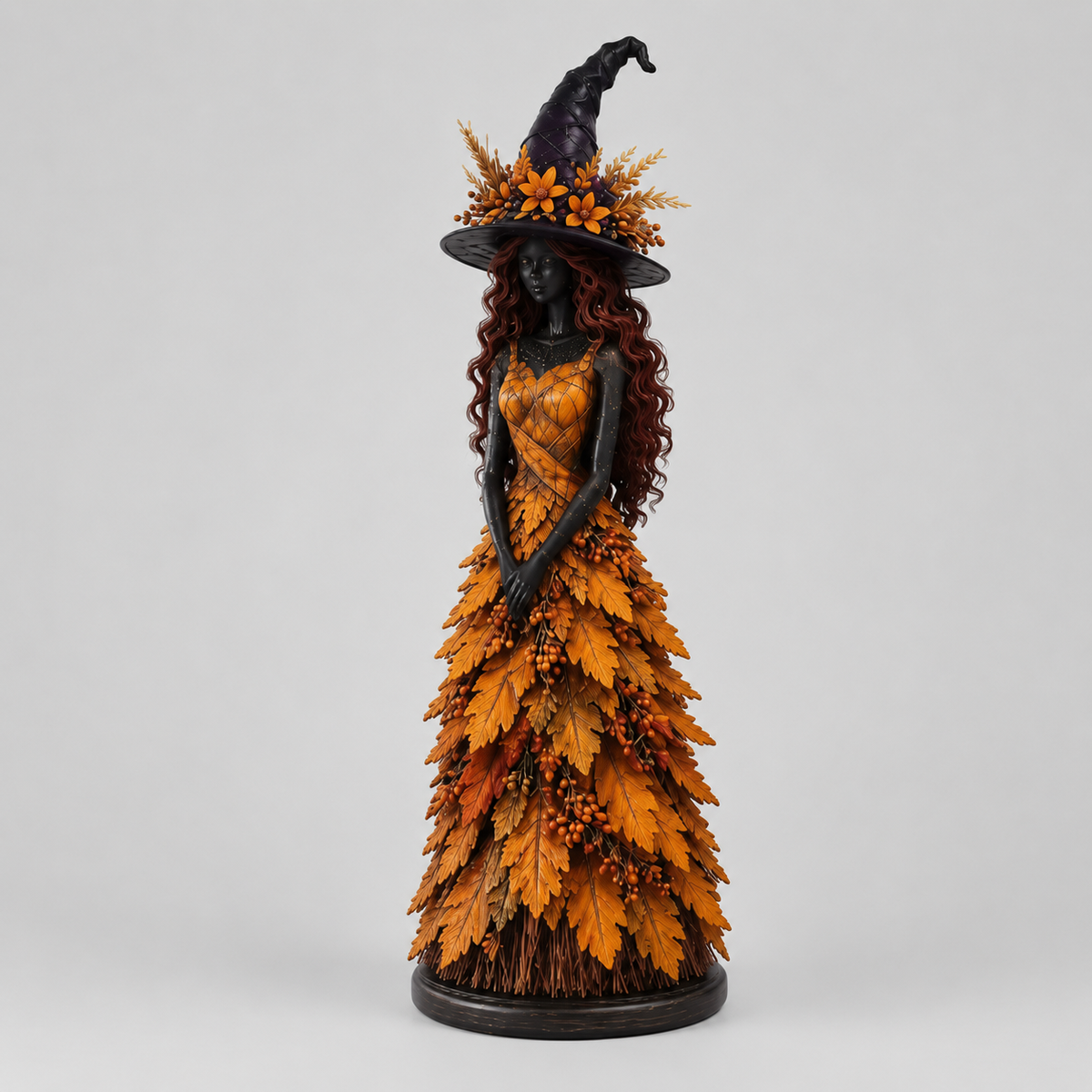 Halloweenbeeldje van een Heks met Gelaagd Herfstbladmotief
